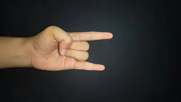 Kaya el işareti izole edilmiş siyah arkaplan