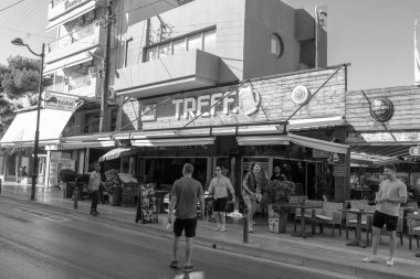 Hersonissos, Crete, Greece- July 18, 2024: TREFF. Imbiss Biergarten a bistro bar in central Hersonissos front view clipart