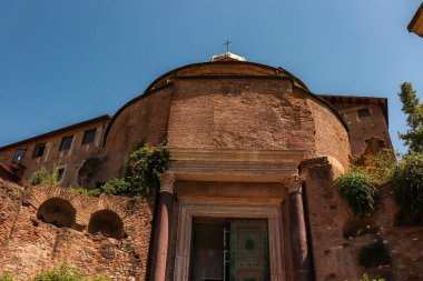 Rome, Italy- July 31, 2019: Exterior closeup view of Temple of Romulus, an ancient Roman temple located at the Roman Forum  clipart