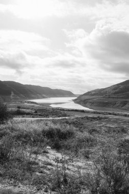 Lake Kouris nature landscape viewpoint near Alassa village, Cyprus in black and white