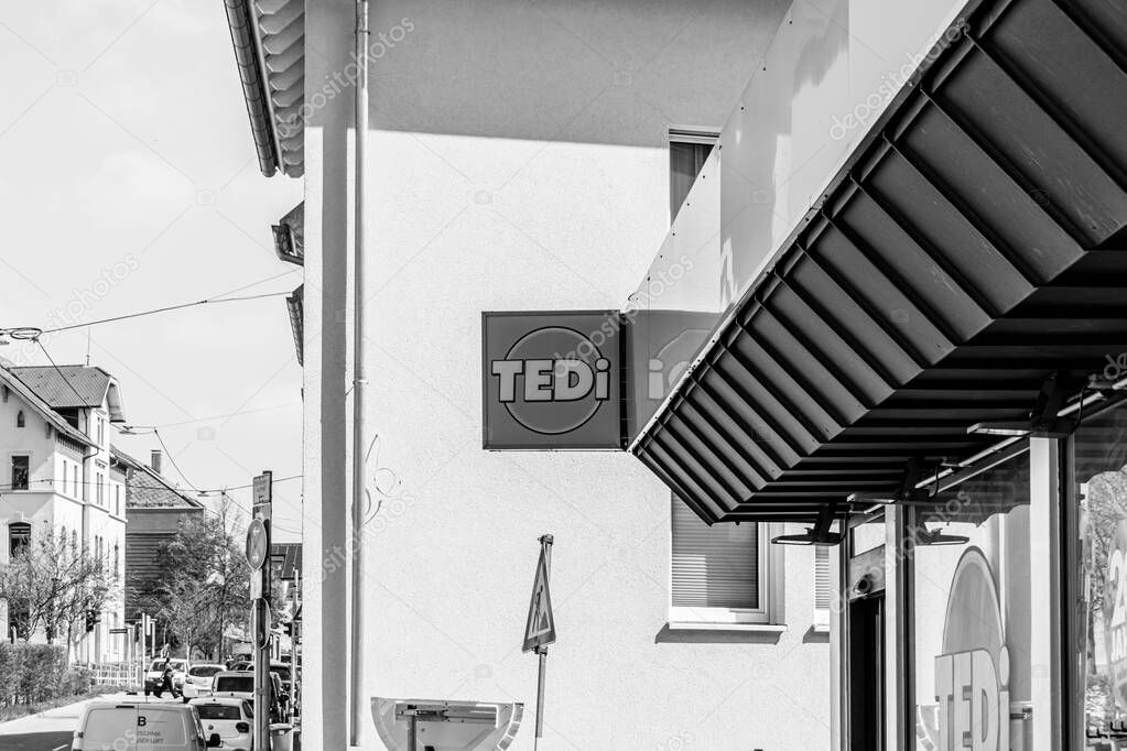 Stuttgart, Germany- March 28, 2025: TEDi, a German non- food retailer Mohringen neighborhood store location sign in black and white