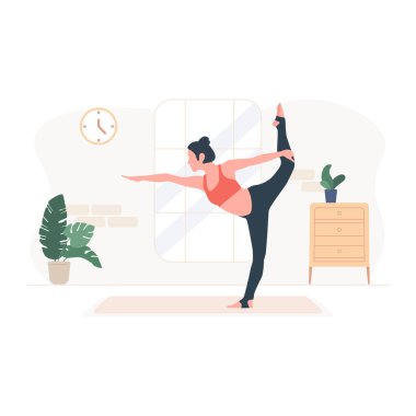 Evde yoga egzersizi yapan genç bir kadın..