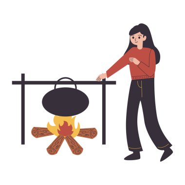 Genç bir kadın barbeküde yemek pişiriyor.