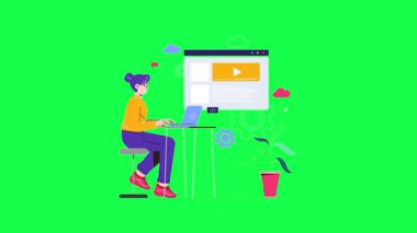 Yeşil takım elbiseli genç bir kadın dizüstü bilgisayar, bilgisayar, uzaktan kumanda ve video kullanıyor.