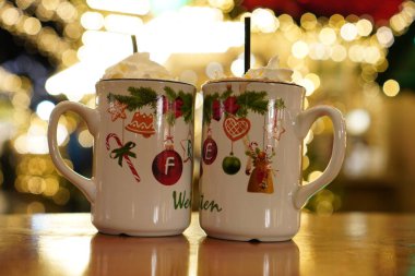 Mug of hot chocolate with marshmallows at a Christmas market. Festive drink portrait in winter. clipart