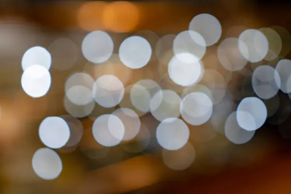 Zarif Altın sarısı Noel Işıklarından yapılmış Bokeh 'le ışıldayan Arkaplan.