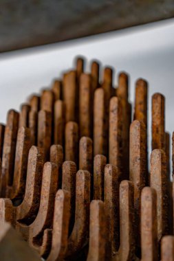 A large pile of rusty metal sticks, arranged in a way that resembles a cactus. The sticks are all different sizes and shapes, and they are all brown in color. Scene is somewhat eerie and unsettling clipart