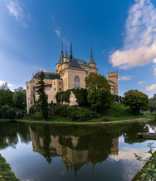 stock image Bojnice, Slovakia - 26 September, 2022: view of the Bojnice Castle with reflections in the moat
