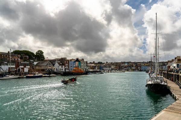 stock image Weymouth, United Kingdom - 7 September, 2022: downtown Weymouth and fishing boats on the River Wey in Dorset