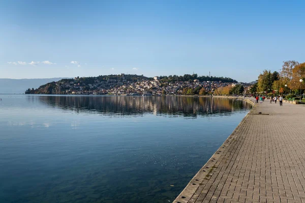 stock image Ohrid, North Macedonia - 1 November, 2022: landscape view of Lake Ohrid and the waterfront with the castle on the hilltop