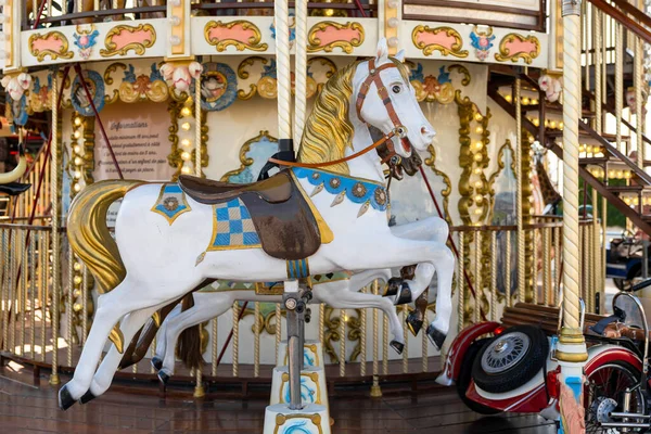 stock image Saintes-Maries-de-la-Mer, France - 4 March, 2023: detail view of a classic and historic merry-go-round carousel with a horse and race car