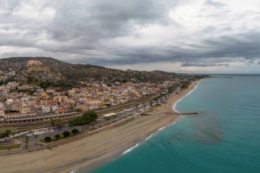 Roccella Ionica, Italy - 15 December, 2023: drone perspective of the picturesque Calabrian village of Roccella Ionica clipart