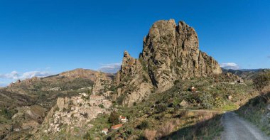 Pentedattilo, Italy - 16 December, 2023: panorama view of the Aspromonte ghost town of Pentedattilo in Calabria clipart
