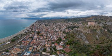 Roccella Ionica, Italy - 15 December, 2023: drone perspective of the picturesque Calabrian village of Roccella Ionica clipart