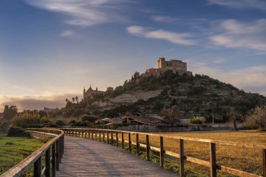 Arta, Spain - 23 January, 2024: view of the landmark Arta Sanctuary on the hill in warm evening light clipart