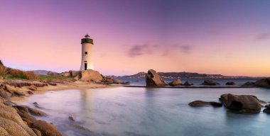 panorama landscape view of the Punta Palau Lighthouse on the Emerald Coast of Sardinia at sunrise clipart