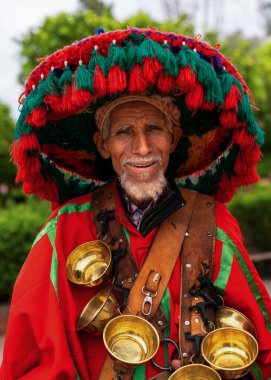 Marrakesh, Morocco - 23 March, 2024: portrait of the traditional water seller in his decorative uniform in downtown Marrakesh clipart