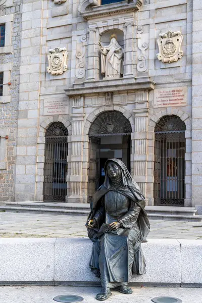 stock image Avila, Spain - 8 April, 2024: view of the statue and birthplace and church of Saint Teresa of Avila