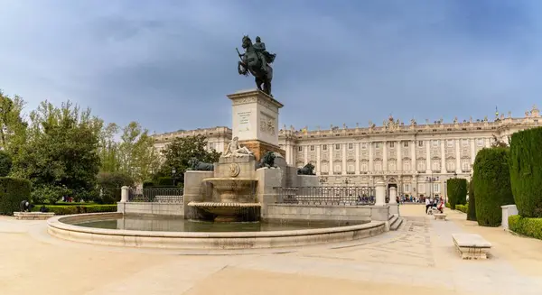 stock image Madrid, Spain - 6 April, 2024: view of the Spanish royal palace and the Felipe IV Monument in downtown Madrid