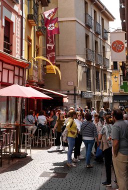 Leon, Spain - 13 April, 2024: people enjoying a beautiful spring day in the colourful historic city center of Leon clipart