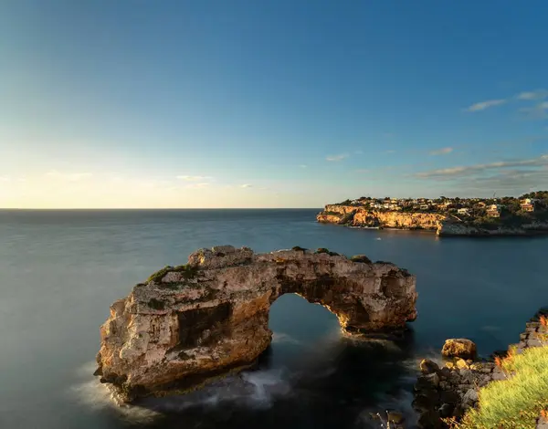 stock image A long exposure view of the natural limestone arch of Es Pontas on Mallorca