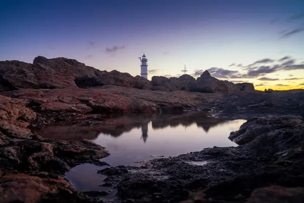 Stock image A long exposure view of the Cap de ses Salines Lighthouse on Mallorca at sunrise