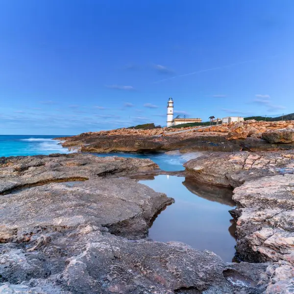 Stock image A long exposure view of the Cap de ses Salines Lighthouse on Mallorca just before sunrise