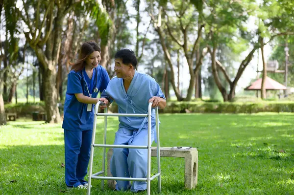 Asian Female Doctor Help Support Senior Patient and Provide Encouragement During Treatment. Rehabilitation or Physical Therapy of Asian Retired Patients with Walking Aids.