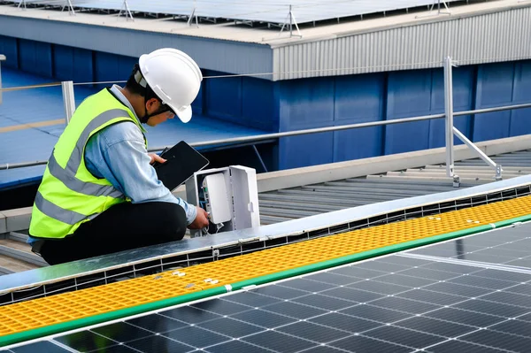 Engineers or Specialist technicians check the information of quality installing solar photovoltaic panels through the internet system and measure various values through a wireless transmitter.