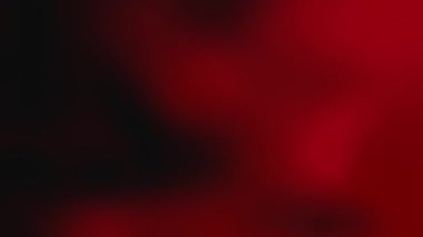 Hipnotik sıvı gradyan video koyu siyah yavaş yavaş yoğun kırmızıya dönüşüyor. Enerjik ve dramatik geçiş, güç, tutku ve dinamizmi çağrıştırıyor..