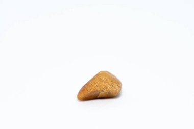 A close-up macro shot of smooth, colorful pebble stones arranged on a white background, showcasing their natural textures and intricate details. clipart