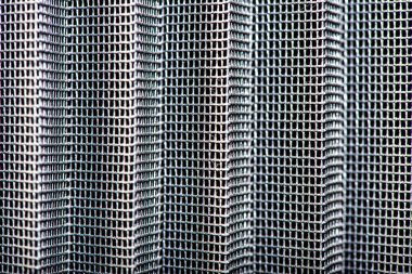 Detaylı ve dokulu bir arkaplan olarak kullanılan sineğin karmaşık tasarımı ve dokusu içeren makro bir fotoğraf..