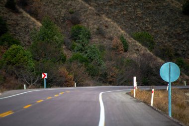 Detailed asphalt road profile: A closeup view showcasing the texture and surface intricacies of the road, inviting exploration of its unique characteristics clipart