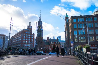 Amsterdam streets come alive with festive lights and a cheerful atmosphere just before the New Year, capturing the lively city's spirit. clipart