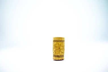 A winecork-whitebackground presents a close-up view of a cork, a vital component in preserving the quality and flavor of wine. clipart