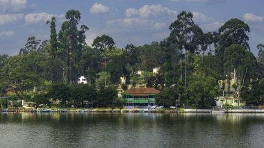 The Yercaud Boat Club offers a delightful boating experience on the serene Emerald Lake in Yercaud, Tamil Nadu. Surrounded by lush greenery and hills, visitors can enjoy a peaceful paddle boat ride or rent a speedboat for a more thrilling adventure. clipart