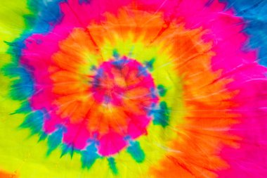 Kumaş dokusunda renkli soyut kravat boyası, renkli spiral kravat boyası soyut desen arka plan.