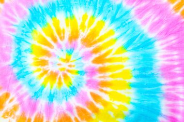 Kumaş dokusunda renkli soyut kravat boyası, renkli spiral kravat boyası soyut desen arka plan.