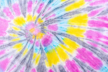 Kumaş dokusunda renkli soyut kravat boyası, renkli spiral kravat boyası soyut desen arka plan.