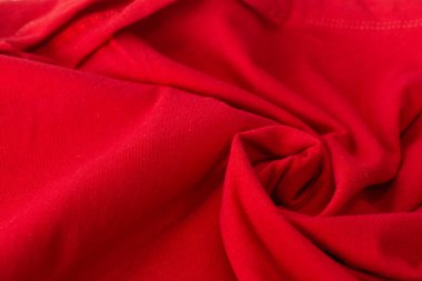 Kapalı kırmızı kırışık kumaş dokusu, buruşuk kırmızı kumaş arkaplan.