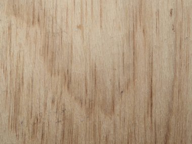 Hafif ahşap bir yüzeye yakından bakınca eşsiz tahıl desenleri ve ince kusurlar görülüyor. Doku, materyalin doğal güzelliğini ve tarihini yansıtıyor..