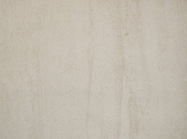 Açık gri beton bir duvar yumuşak bir yüzeye sahiptir. Zayıf dokusu ve tonsal varyasyonları vardır. İyi ışıklandırılmış bir iç mekanda çağdaş bir titreşim yaratır..