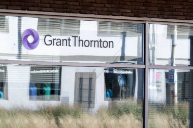 OSTRAVA, CZECHIA - SEPTEMBER 28, 2023: Office of Grant Thornton company, one of largest accounting firms in world clipart