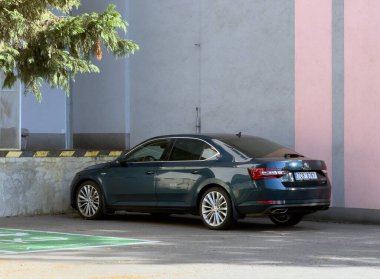 OSTRAVA, CZECHIA - OCTOBER 19, 2024: Skoda Superb III 4x4 liftback car parked on street clipart