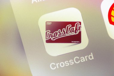 OSTRAVA, CZECHIA - JULY 27, 2024: Mobile app CrossCard for CrossCafe loyal customers on iOS device clipart