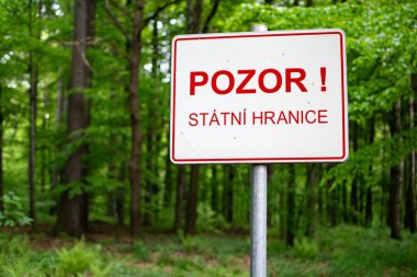 Warning sign BEWARE, NATIONAL BORDER written in Czech language clipart