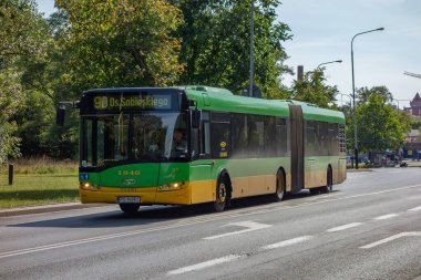 POZNAN, POLAND - AUGUST 12, 2018: Solaris Urbino 18 articulated bus of MKP transportation company in Poznan, Poland clipart