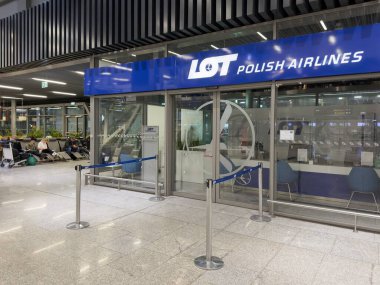 KRAKOW, POLAND - OCTOBER 27, 2024: Storefront of LOT Polish Airlines company on airport in Poland clipart