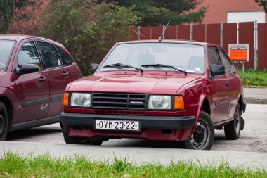 HAVIROV, CZECH REPUBLIC - NOVEMBER 7, 2024: Czech Skoda 130L Rapid sport coupe car from 1980s parked on street clipart