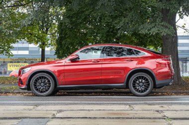 OSTRAVA, CZECHIA - OCTOBER 19, 2023: Mercedes-Benz GLC Coupe C253 crossover car parked on street, side view clipart